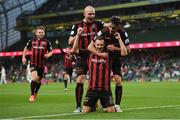 15 July 2021; Liam Burt of Bohemians is congratulated by team-mates Georgie Kelly, left, and Dawson Devoy after scoring their side's third goal during the UEFA Europa Conference League first qualifying round second leg match between Bohemians and Stjarnan at the Aviva Stadium in Dublin. Photo by Seb Daly/Sportsfile