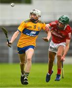 14 July 2021; Conor Whelan of Clare in action against James Byrne of Cork during the 2021 Electric Ireland Munster GAA Hurling Minor Championship Quarter-Final match between Clare and Cork at Semple Stadium in Thurles, Tipperary. Photo by Eóin Noonan/Sportsfile