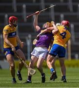 17 July 2021; Simon Donohoe of Wexford is tackled by Paul Flanagan of Clare during the GAA Hurling All-Ireland Senior Championship Round 1 match between Clare and Wexford at Semple Stadium in Thurles, Tipperary. Photo by Piaras Ó Mídheach/Sportsfile