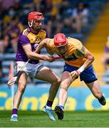 17 July 2021; Paul Flanagan of Clare in action against  Paul Morris of Wexford during the GAA Hurling All-Ireland Senior Championship Round 1 match between Clare and Wexford at Semple Stadium in Thurles, Tipperary. Photo by Piaras Ó Mídheach/Sportsfile