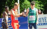 17 July 2021; Robert McDonnell, right, of Ireland and Oliwer Wdowik of Poland fist bump after competing in the semi-final of the men's 200 metres during day three of the European Athletics U20 Championships at the Kadriorg Stadium in Tallinn, Estonia. Photo by Marko Mumm/Sportsfile