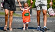17 July 2021; Heidi Harold, aged 2, walks to the stadium with her parents Former Armagh footballer Stephen Harold, and his wife Laura, before the Ulster GAA Football Senior Championship Semi-Final match between Armagh and Monaghan at Páirc Esler in Newry, Down. Photo by Sam Barnes/Sportsfile