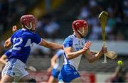 17 July 2021; Calum Lyons of Waterford is hooked by Ciaran Collier of Laois during the GAA Hurling All-Ireland Senior Championship Round 1 match between Laois and Waterford at UPMC Nowlan Park in Kilkenny. Photo by Harry Murphy/Sportsfile