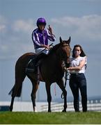 17 July 2021; Ryan Moore on Snowfall with groom Amy Butler after winning the Juddmonte Irish Oaks at The Curragh Racecourse in Kildare. Photo by David Fitzgerald/Sportsfile