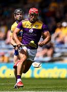 17 July 2021; Lee Chin of Wexford is chased by Tony Kelly of Clare during the GAA Hurling All-Ireland Senior Championship Round 1 match between Clare and Wexford at Semple Stadium in Thurles, Tipperary. Photo by Piaras Ó Mídheach/Sportsfile