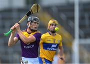 17 July 2021; Diarmuid O'Keeffe of Wexford in action against Colm Galvin of Clare during the GAA Hurling All-Ireland Senior Championship Round 1 match between Clare and Wexford at Semple Stadium in Thurles, Tipperary. Photo by Piaras Ó Mídheach/Sportsfile