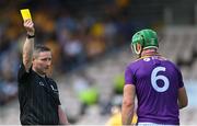 17 July 2021; Fergal Horgan shows the yellow card to Matthew O'Hanlon of Wexford during the GAA Hurling All-Ireland Senior Championship Round 1 match between Clare and Wexford at Semple Stadium in Thurles, Tipperary. Photo by Piaras Ó Mídheach/Sportsfile