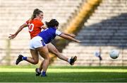 17 July 2021; Kelly Mallon of Armagh shoots to score her side's third goal despite the attention of Shauna Lynch of Cavan during the TG4 All-Ireland Senior Ladies Football Championship Group 2 Round 2 match between Armagh and Cavan at St Tiernach's Park in Monaghan. Photo by Ben McShane/Sportsfile