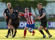 16 July 2021; William Armshaw of Treaty United in action against Sean Brennan, left, and Sam Todd of UCD during the SSE Airtricity League First Division match between Treaty United and UCD at Market's Field in Limerick. Photo by Michael P Ryan/Sportsfile