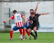 16 July 2021; Evan Caffrey of UCD in action against Matt Keane, and Clyde O'Connell of Treaty United during the SSE Airtricity League First Division match between Treaty United and UCD at Market's Field in Limerick. Photo by Michael P Ryan/Sportsfile