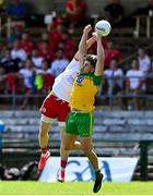 18 July 2021; Stephen McMenamin of Donegal in action against Matthew Donnelly of Tyrone during the Ulster GAA Football Senior Championship Semi-Final match between Donegal and Tyrone at Brewster Park in Enniskillen, Fermanagh. Photo by Sam Barnes/Sportsfile