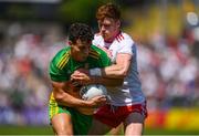 18 July 2021; Odhran McFadden Ferry of Donegal in action against Conor Meyler of Tyrone during the Ulster GAA Football Senior Championship Semi-Final match between Donegal and Tyrone at Brewster Park in Enniskillen, Fermanagh. Photo by Ben McShane/Sportsfile