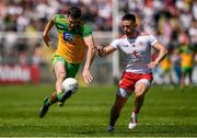 18 July 2021; Caolan McGonigle of Donegal in action against Pádraig Hempsey of Tyrone during the Ulster GAA Football Senior Championship Semi-Final match between Donegal and Tyrone at Brewster Park in Enniskillen, Fermanagh. Photo by Ben McShane/Sportsfile