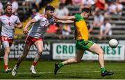18 July 2021; Rory Brennan of Tyrone fouls Ciaran Thompson of Donegal, resulting in a black card, during the Ulster GAA Football Senior Championship Semi-Final match between Donegal and Tyrone at Brewster Park in Enniskillen, Fermanagh. Photo by Ben McShane/Sportsfile