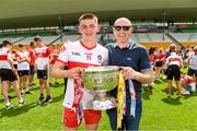 18 July 2021; Former Derry player and 1993 all Ireland winning team captain Henry Downey with his son Derry captain Matthew Downey after the 2020 Electric Ireland GAA Football All-Ireland Minor Championship Final match between Derry and Kerry at Bord Na Mona O’Connor Park in Tullamore. Photo by Matt Browne/Sportsfile