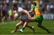 18 July 2021; Kieran McGeary of Tyrone in action against Odhran McFadden Ferry of Donegal during the Ulster GAA Football Senior Championship Semi-Final match between Donegal and Tyrone at Brewster Park in Enniskillen, Fermanagh. Photo by Ben McShane/Sportsfile