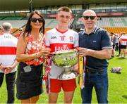 18 July 2021; Derry captain Matthew Downey with his mother Michele and father Henry, former Derry player and 1993 all Ireland winning team captain, after the 2020 Electric Ireland GAA Football All-Ireland Minor Championship Final match between Derry and Kerry at Bord Na Mona O’Connor Park in Tullamore. Photo by Matt Browne/Sportsfile
