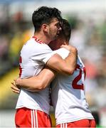 18 July 2021; Conor McKenna, left, and Niall Kelly of Tyrone celebrate after their side's victory in the Ulster GAA Football Senior Championship Semi-Final match between Donegal and Tyrone at Brewster Park in Enniskillen, Fermanagh. Photo by Ben McShane/Sportsfile