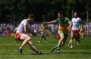 18 July 2021; Conor Meyler of Tyrone in action against Ryan McHugh of Donegal during the Ulster GAA Football Senior Championship Semi-Final match between Donegal and Tyrone at Brewster Park in Enniskillen, Fermanagh. Photo by Ben McShane/Sportsfile