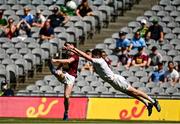 18 July 2021; Ger Egan of Westmeath kicks a point under pressure from David Hyland of Kildare during the Leinster GAA Senior Football Championship Semi-Final match between Kildare and Westmeath at Croke Park in Dublin. Photo by Harry Murphy/Sportsfile