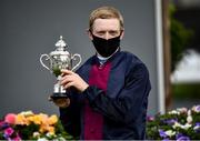 18 July 2021; Jockey Billy Lee celebrates with the cup after winning the Kilboy Estate Stakes on Insinuendo at The Curragh Racecourse in Kildare. Photo by David Fitzgerald/Sportsfile