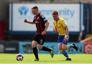 18 July 2021; Jamie Mullins of Bohemians in action against Aodh Dervin of Longford Town during the SSE Airtricity League Premier Division match between Bohemians and Longford Town at Dalymount Park in Dublin. Photo by Michael P Ryan/Sportsfile