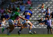 18 July 2021; John O'Dwyer of Tipperary shoots past Seán Finn of Limerick to score his side's second goal, in the 19th minute, during the Munster GAA Hurling Senior Championship Final match between Limerick and Tipperary at Páirc Uí Chaoimh in Cork. Photo by Ray McManus/Sportsfile
