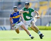 18 July 2021; Diarmaid Byrnes of Limerick in action against Alan Flynn of Tipperary during the Munster GAA Hurling Senior Championship Final match between Limerick and Tipperary at Páirc Uí Chaoimh in Cork. Photo by Piaras Ó Mídheach/Sportsfile