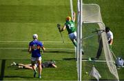 18 July 2021; An umpire reaches for a green flag as Séamus Flanagan of Limerick celebrates scoring a goal in the 42nd minute during the Munster GAA Hurling Senior Championship Final match between Limerick and Tipperary at Páirc Uí Chaoimh in Cork. Photo by Ray McManus/Sportsfile