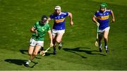 18 July 2021; Diarmaid Byrnes of Limerick in action against Séamus Kennedy and Noel McGrath of Tipperary during the Munster GAA Hurling Senior Championship Final match between Limerick and Tipperary at Páirc Uí Chaoimh in Cork. Photo by Ray McManus/Sportsfile