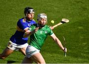 18 July 2021; Cian Lynch of Limerick is tackled by Dan McCormack of Tipperary  during the Munster GAA Hurling Senior Championship Final match between Limerick and Tipperary at Páirc Uí Chaoimh in Cork. Photo by Ray McManus/Sportsfile