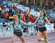18 July 2021; Lauren McCourt, right, passes the baton to team-mate Caoimhe Cronin of Ireland in the final of women's 4x400m Relay during day four of the European Athletics U20 Championships at the Kadriorg Stadium in Tallinn, Estonia. Photo by Marko Mumm/Sportsfile
