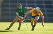 19 July 2021; Aidan Moriarty of Clare in action against Aidan O'Connor of Limerick during the Munster GAA Hurling U20 Championship semi-final match between Limerick and Clare at the LIT Gaelic Grounds in Limerick. Photo by Ben McShane/Sportsfile