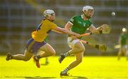 19 July 2021; Jimmy Quilty of Limerick in action against Adam Hogan of Clare during the Munster GAA Hurling U20 Championship semi-final match between Limerick and Clare at the LIT Gaelic Grounds in Limerick. Photo by Ben McShane/Sportsfile