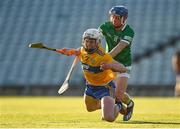 19 July 2021; Adam Hogan of Clare is fouled by Bryan Nix of Limerick during the Munster GAA Hurling U20 Championship semi-final match between Limerick and Clare at the LIT Gaelic Grounds in Limerick. Photo by Ben McShane/Sportsfile