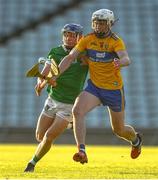 19 July 2021; Adam Hogan of Clare in action against Bryan Nix of Limerick during the Munster GAA Hurling U20 Championship semi-final match between Limerick and Clare at the LIT Gaelic Grounds in Limerick. Photo by Ben McShane/Sportsfile