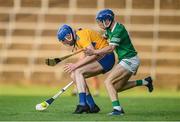 19 July 2021; Adam Mungovan of Clare in action against Bryan Nix of Limerick during the Munster GAA Hurling U20 Championship semi-final match between Limerick and Clare at the LIT Gaelic Grounds in Limerick. Photo by Ben McShane/Sportsfile