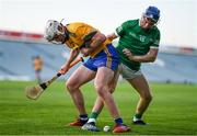 19 July 2021; Adam Hogan of Clare in action against Aidan O'Connor of Limerick during the Munster GAA Hurling U20 Championship semi-final match between Limerick and Clare at the LIT Gaelic Grounds in Limerick. Photo by Ben McShane/Sportsfile