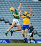 19 July 2021; Cathal O'Neill of Limerick in action against Paddy Donnellan of Clare during the Munster GAA Hurling U20 Championship semi-final match between Limerick and Clare at the LIT Gaelic Grounds in Limerick. Photo by Ben McShane/Sportsfile