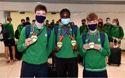 19 July 2021; Team Ireland members, from left, Cian McPhillips, Rhasidat Adeleke and Nicholas Griggs with their medals at Dublin Airport as Team Ireland return home from the European U20 Athletics Championships. Photo by Sam Barnes/Sportsfile