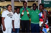 19 July 2021; Rhasidat Adeleke of Ireland with her brother Abdullahi, second from left, and mother Adewumi Ademola, right, and her Women's 100m and 200m gold medals alongside 4x100 metre relay team member Israel Olatunde and his mother Elizabeth at Dublin Airport as Team Ireland return home from the European U20 Athletics Championships. Photo by Sam Barnes/Sportsfile