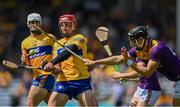 17 July 2021; John Conlon of Clare in action against Jack O'Connor of Wexford during the GAA Hurling All-Ireland Senior Championship Round 1 match between Clare and Wexford at Semple Stadium in Thurles, Tipperary. Photo by Piaras Ó Mídheach/Sportsfile