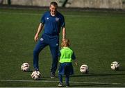 20 July 2021; Republic of Ireland Under-21 Manager Jim Crawford with Ruadh Pierce, aged six, during Football For All INTERsport Elverys Summer Soccer School at Carrigaline United AFC, Carrigaline in Cork. Photo by Harry Murphy/Sportsfile