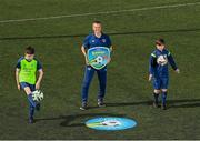 20 July 2021; Republic of Ireland Under-21 Manager Jim Crawford with Matthew McCarthy, aged 14, from Carrigdine, left, and David Wall, aged 15, from Wilton, during Football For All INTERsport Elverys Summer Soccer School at Carrigaline United AFC, Carrigaline in Cork. Photo by Harry Murphy/Sportsfile