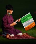 20 July 2021; Ten year old Ali Khan, from Clonsilla in Dublin, with a Tricolour on the pitch during the celebration of Eid Al-Adha at Croke Park in Dublin. Photo by Ray McManus/Sportsfile