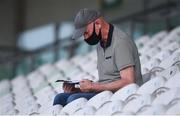 20 July 2021; Kilkenny senior hurling manager Brian Cody inspects the programme during the Leinster GAA Hurling U20 Championship semi-final match between Kilkenny and Galway at Bord Na Mona O'Connor Park in Tullamore, Offaly. Photo by David Fitzgerald/Sportsfile
