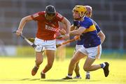 20 July 2021; Padraig Power of Cork in action against Conor O'Dwyer of Tipperary during the Munster GAA Hurling U20 Championship semi-final match between Tipperary and Cork at Semple Stadium in Thurles, Tipperary. Photo by Ben McShane/Sportsfile