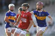 20 July 2021; Daniel Hogan of Cork in action against Kieth Ryan of Tipperary during the Munster GAA Hurling U20 Championship semi-final match between Tipperary and Cork at Semple Stadium in Thurles, Tipperary. Photo by Ben McShane/Sportsfile