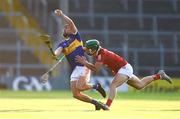 20 July 2021; Max Hackett of Tipperary in action against Brian O'Sullivan of Cork during the Munster GAA Hurling U20 Championship semi-final match between Tipperary and Cork at Semple Stadium in Thurles, Tipperary. Photo by Ben McShane/Sportsfile