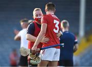 20 July 2021; Cork manager Pat Ryan and Dáire O'Leary of Cork embrace after their side's victory in the Munster GAA Hurling U20 Championship semi-final match between Tipperary and Cork at Semple Stadium in Thurles, Tipperary. Photo by Ben McShane/Sportsfile